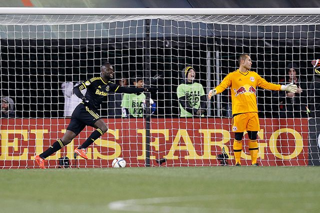 Kei Kamara #23 of the Columbus Crew SC celebrates as Luis Robles #31 of the New York Red Bulls reacts to giving up a gaol during the second half
